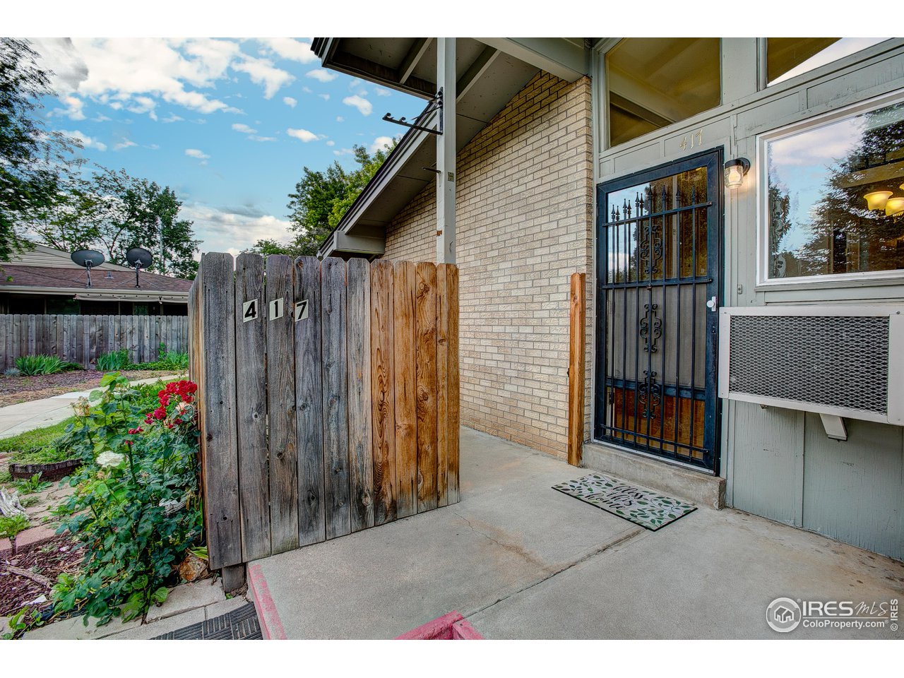417 East Drake Road, Unit F4 Fort Collins, CO 80525 - Photo 2 of 23 Private concrete patio thru wooden gate
