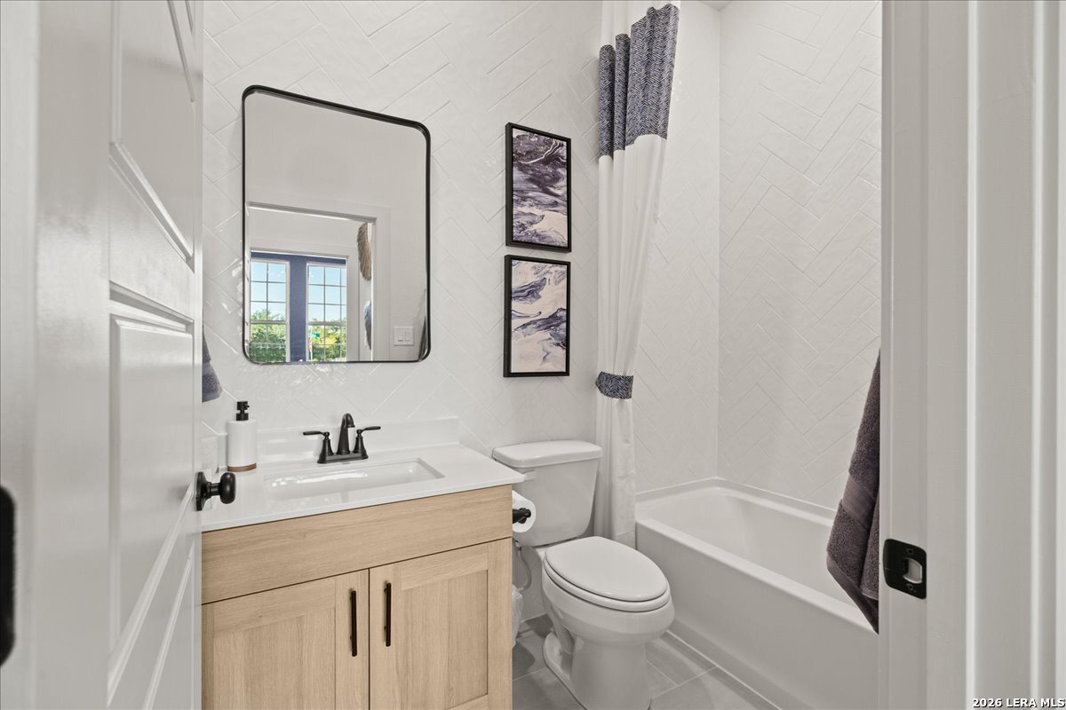 2126 Shepards Street Seguin, TX 78155 - Photo 12 of 20 a bathroom with a toilet sink and mirror