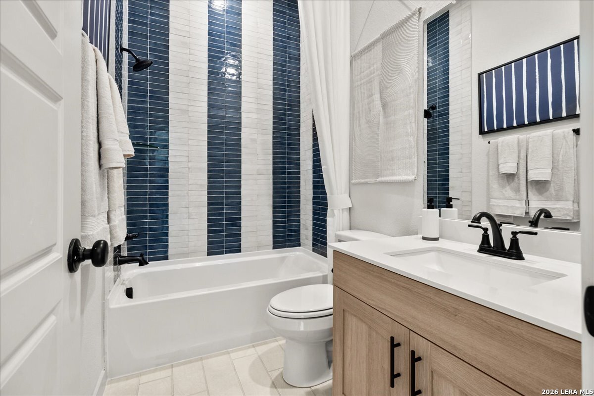 2126 Shepards Street Seguin, TX 78155 - Photo 13 of 20 a bathroom with a sink a toilet and shower