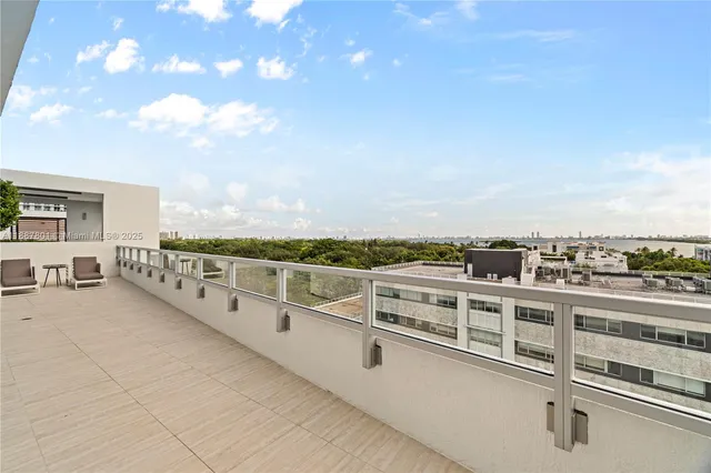 a view of a balcony with city view