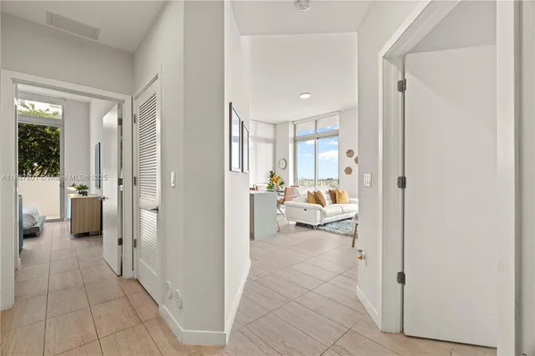 a view of a bedroom with a furniture and the livingroom