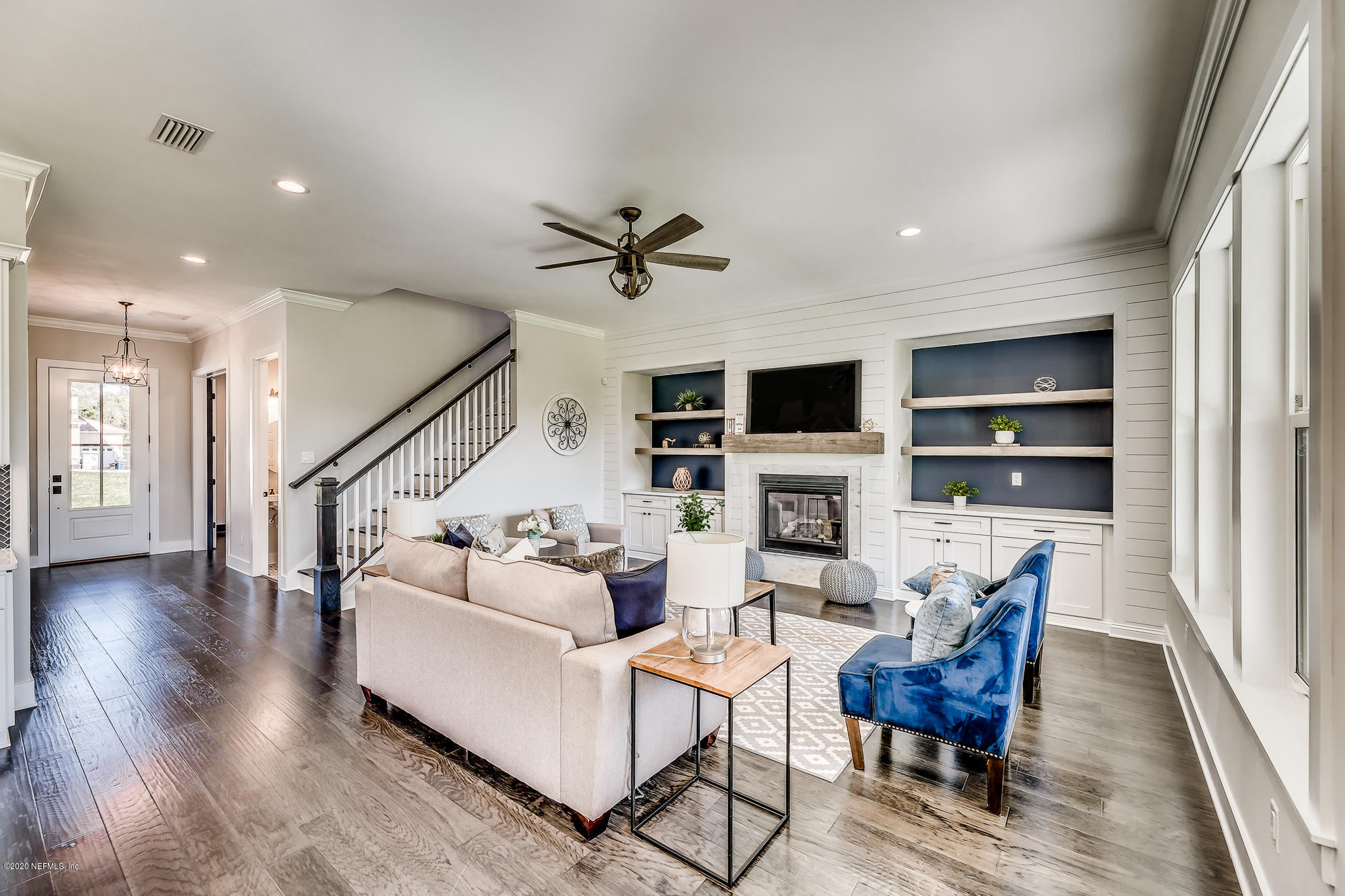 12507 Hidden Drive Jacksonville, FL 32225 - Photo 11 of 66 a living room with fireplace furniture and a flat screen tv