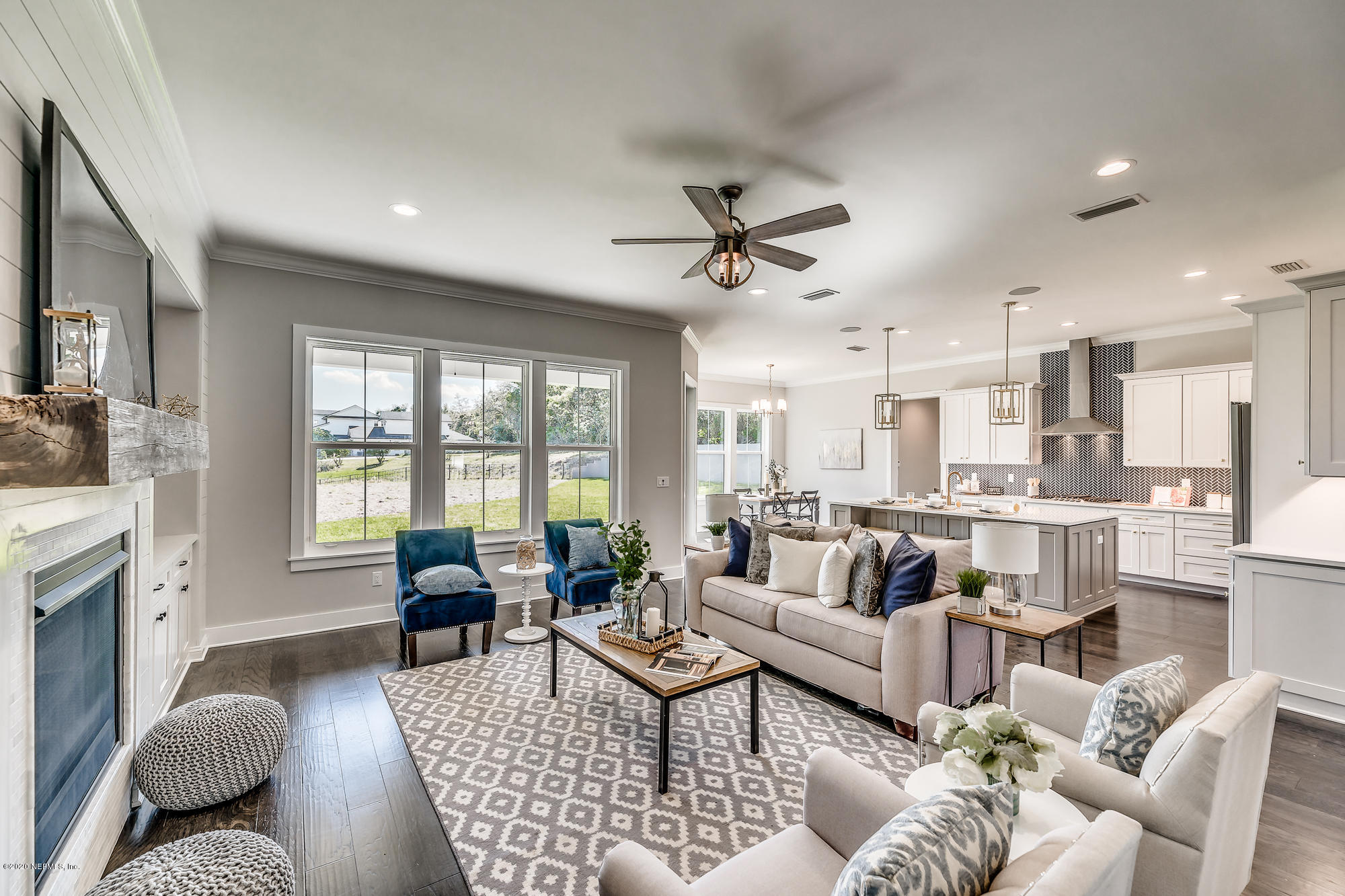 12507 Hidden Drive Jacksonville, FL 32225 - Photo 13 of 66 a living room with fireplace furniture and a large window