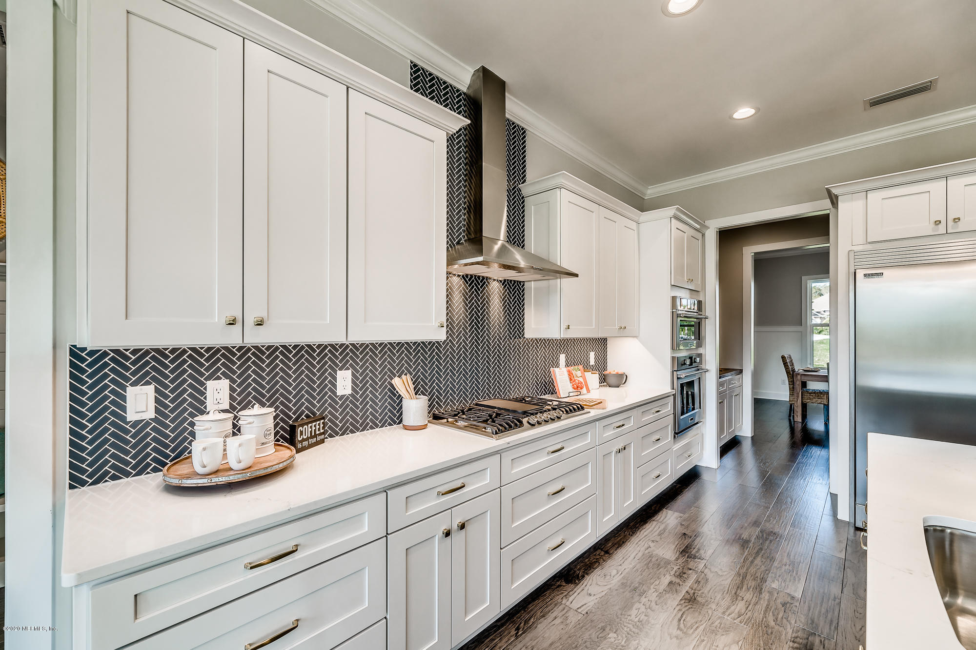 12507 Hidden Drive Jacksonville, FL 32225 - Photo 17 of 66 a kitchen with stainless steel appliances granite countertop a sink stove and refrigerator