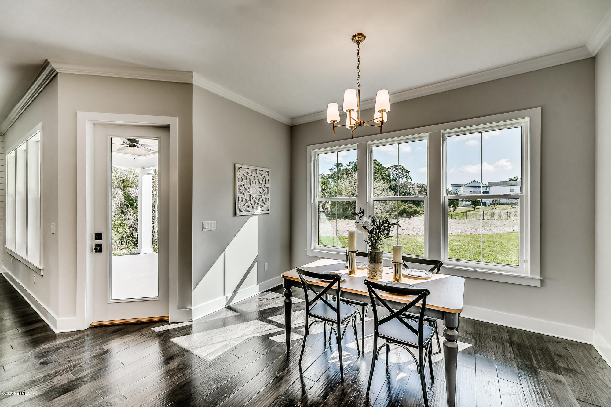 12507 Hidden Drive Jacksonville, FL 32225 - Photo 21 of 66 a view of a dining room with furniture window and wooden floor