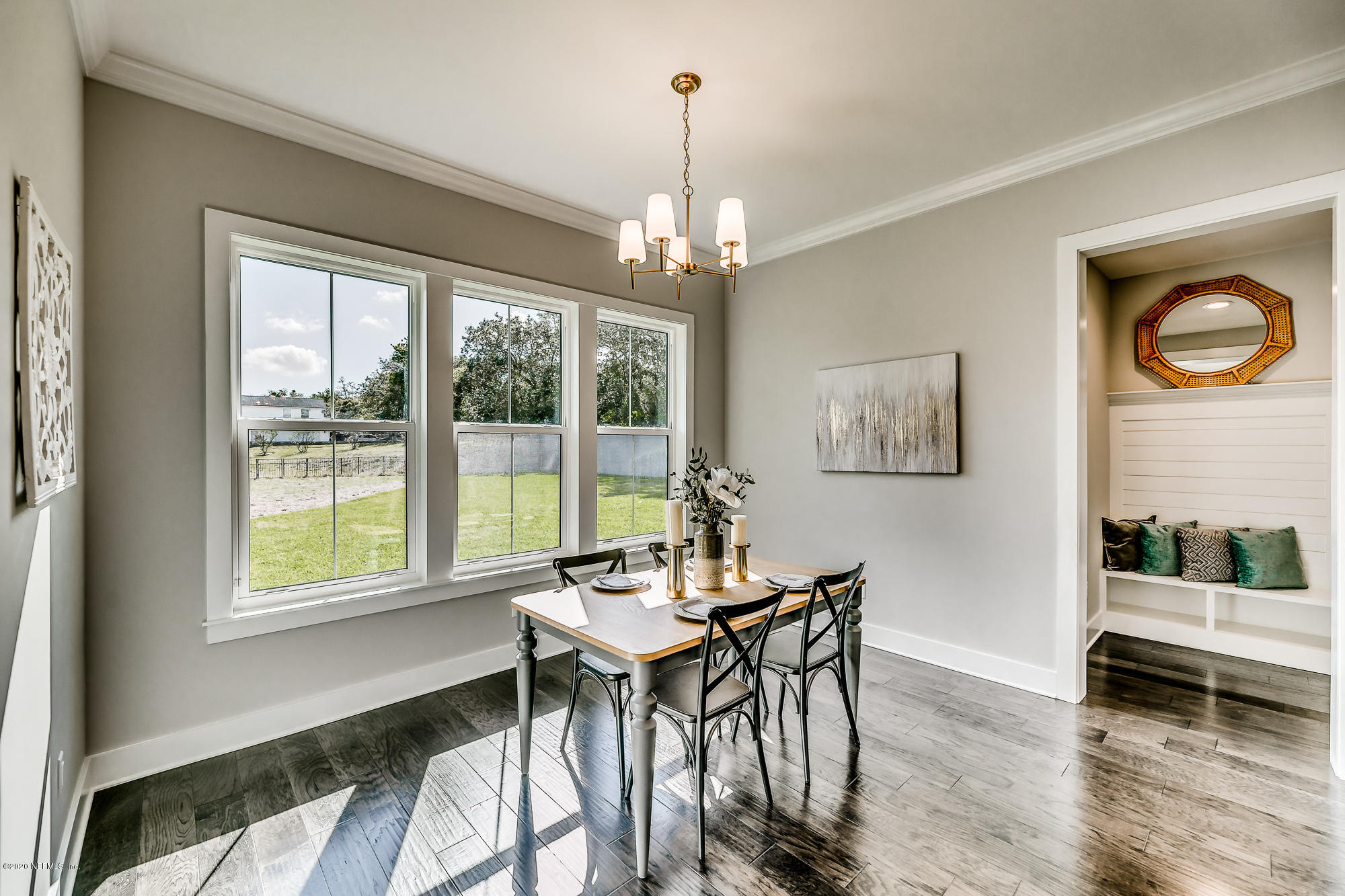 12507 Hidden Drive Jacksonville, FL 32225 - Photo 22 of 66 a dining room with furniture a chandelier and wooden floor