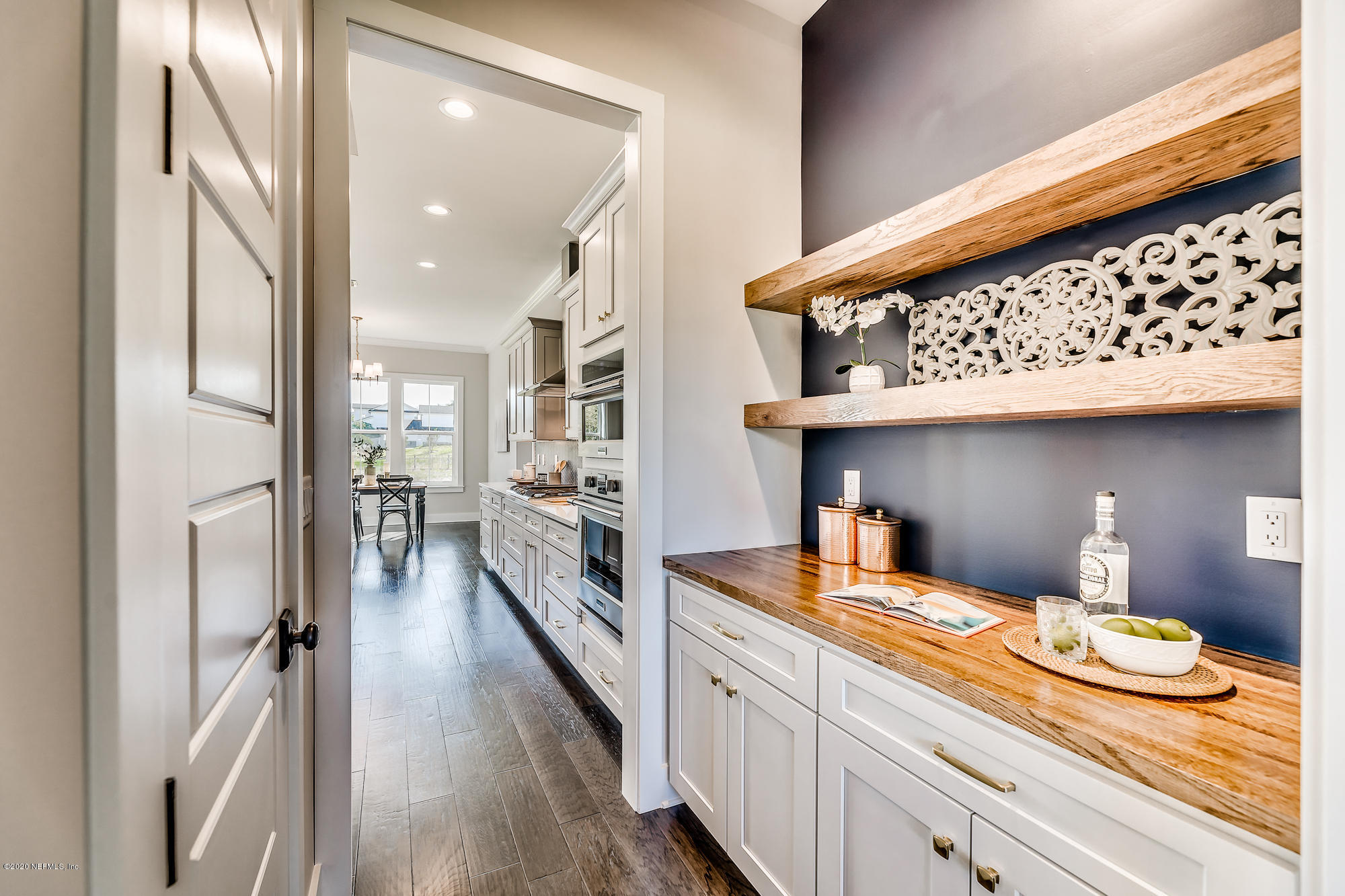 12507 Hidden Drive Jacksonville, FL 32225 - Photo 24 of 66 a kitchen with stainless steel appliances granite countertop a lot of counter space and wooden floor