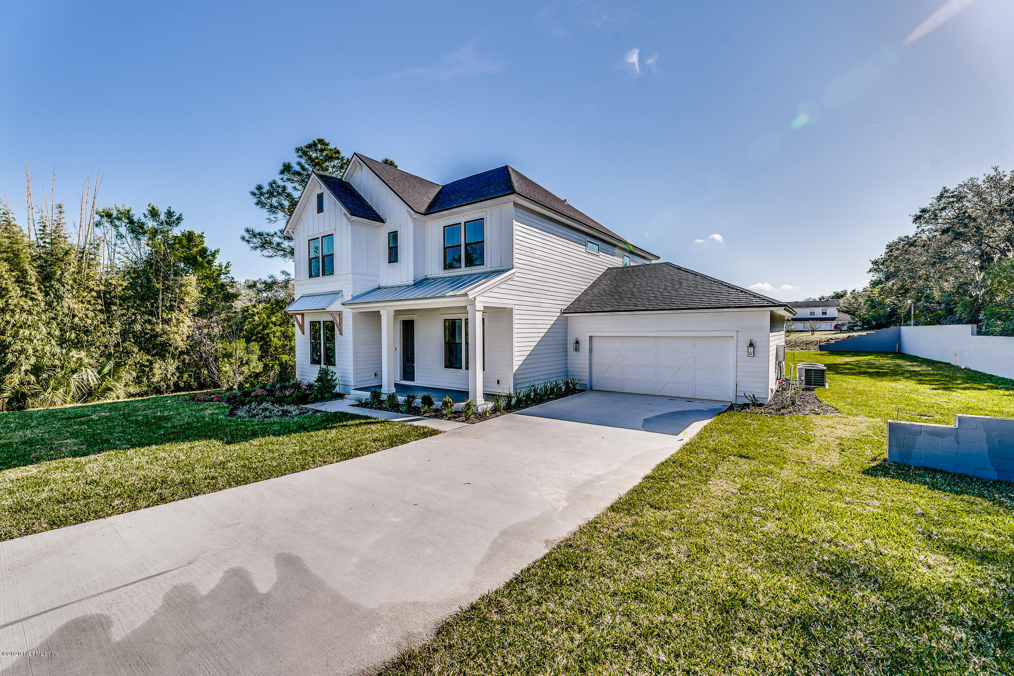 12507 Hidden Drive Jacksonville, FL 32225 - Photo 3 of 66 a front view of a house with a yard and garage