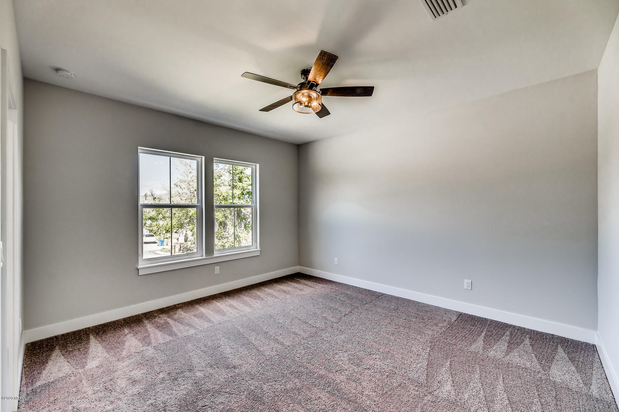12507 Hidden Drive Jacksonville, FL 32225 - Photo 34 of 66 an empty room with windows and fan
