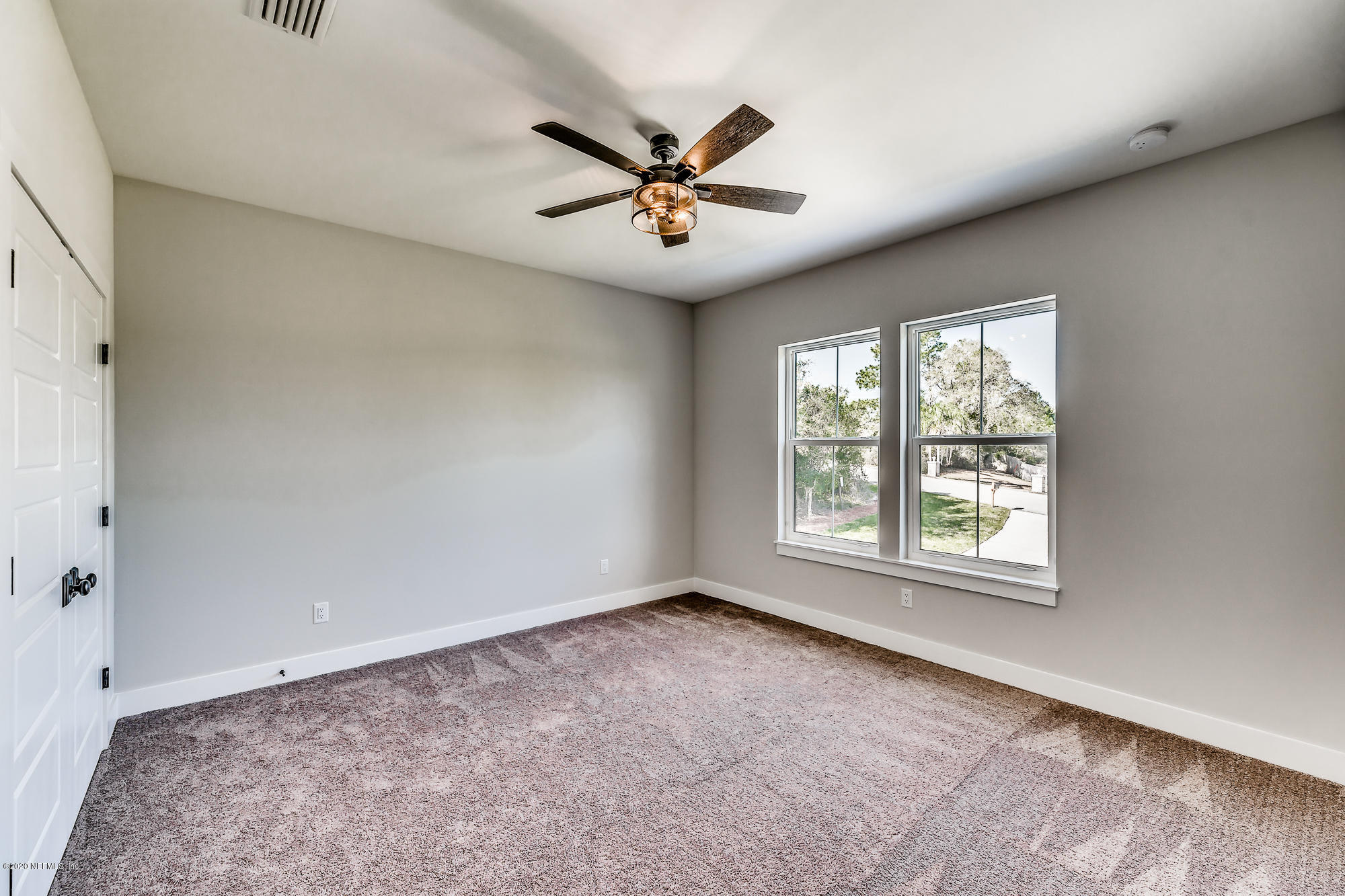12507 Hidden Drive Jacksonville, FL 32225 - Photo 36 of 66 a view of a livingroom with a ceiling fan and window