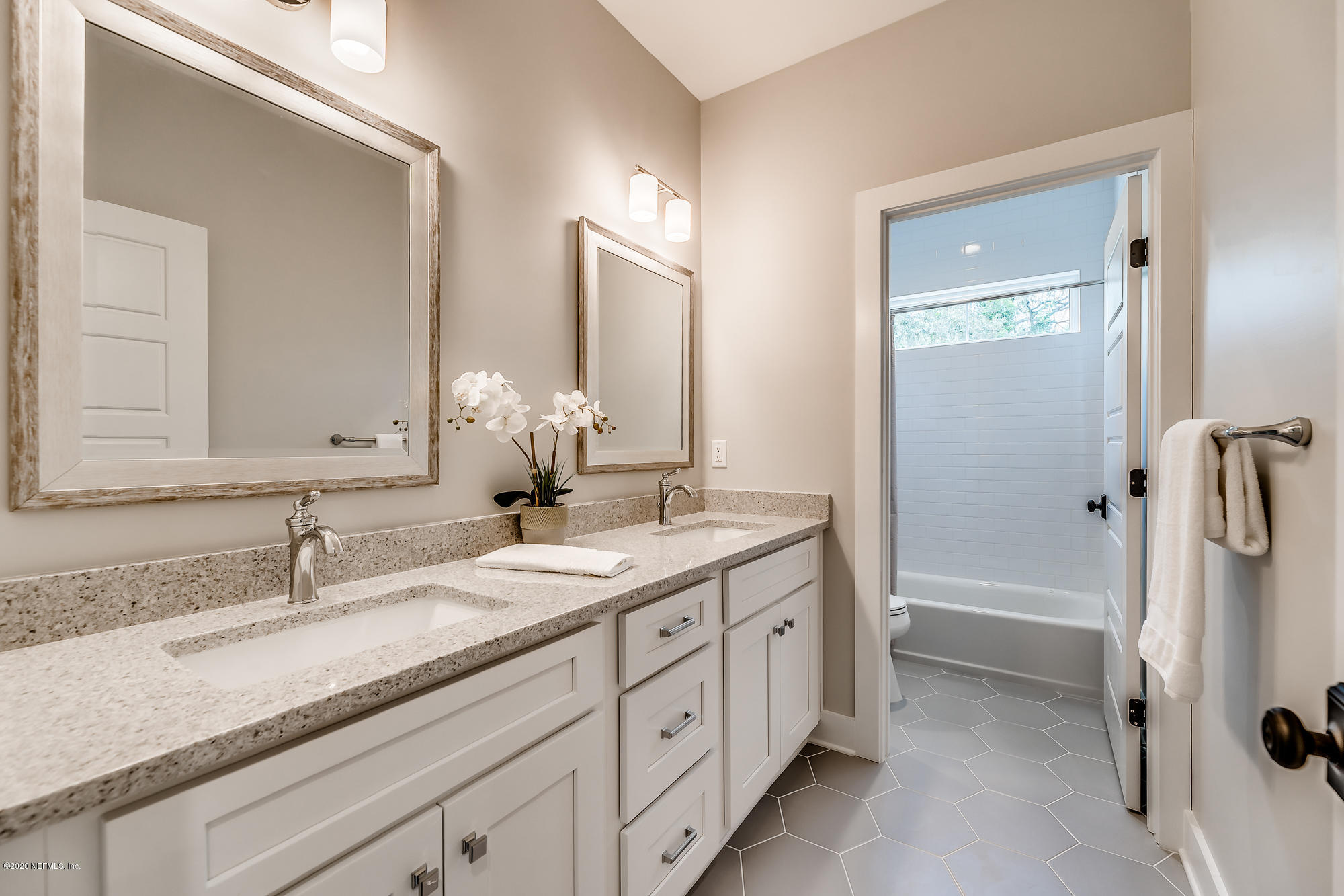 12507 Hidden Drive Jacksonville, FL 32225 - Photo 39 of 66 a bathroom with a granite countertop sink mirror and a
