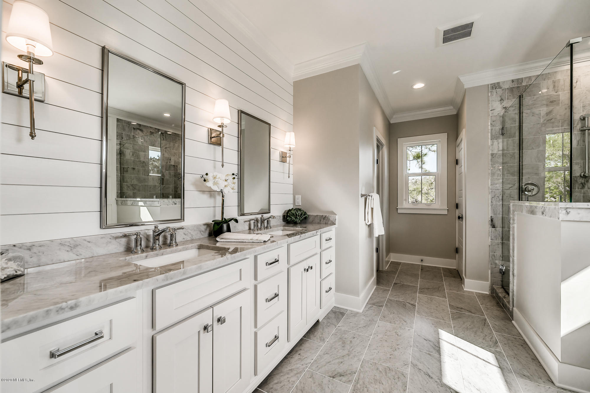 12507 Hidden Drive Jacksonville, FL 32225 - Photo 48 of 66 a spacious bathroom with double sink and a large mirror