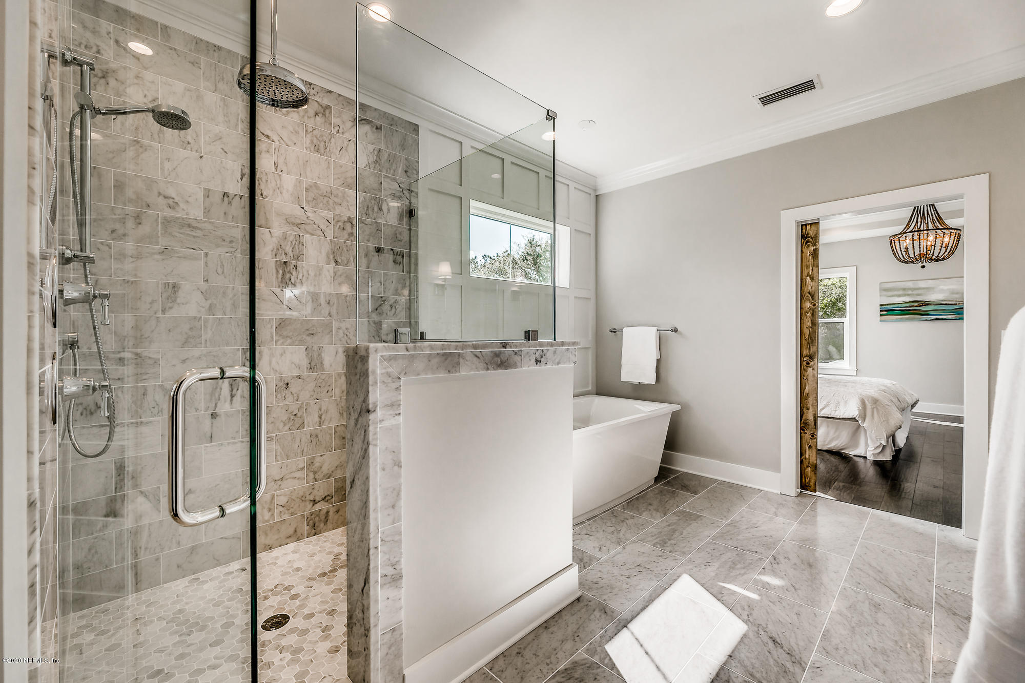 12507 Hidden Drive Jacksonville, FL 32225 - Photo 50 of 66 a large white bathroom with a glass shower door