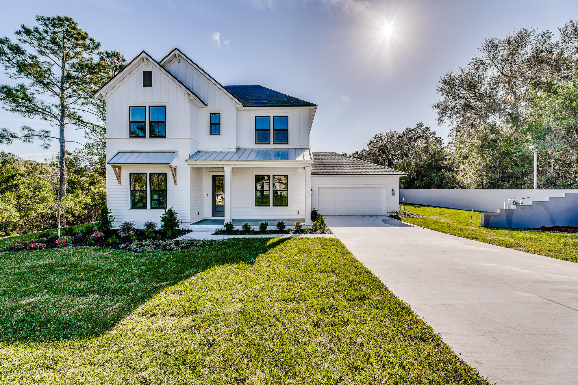 12507 Hidden Drive Jacksonville, FL 32225 - Photo 54 of 66 a front view of a house with swimming pool and porch