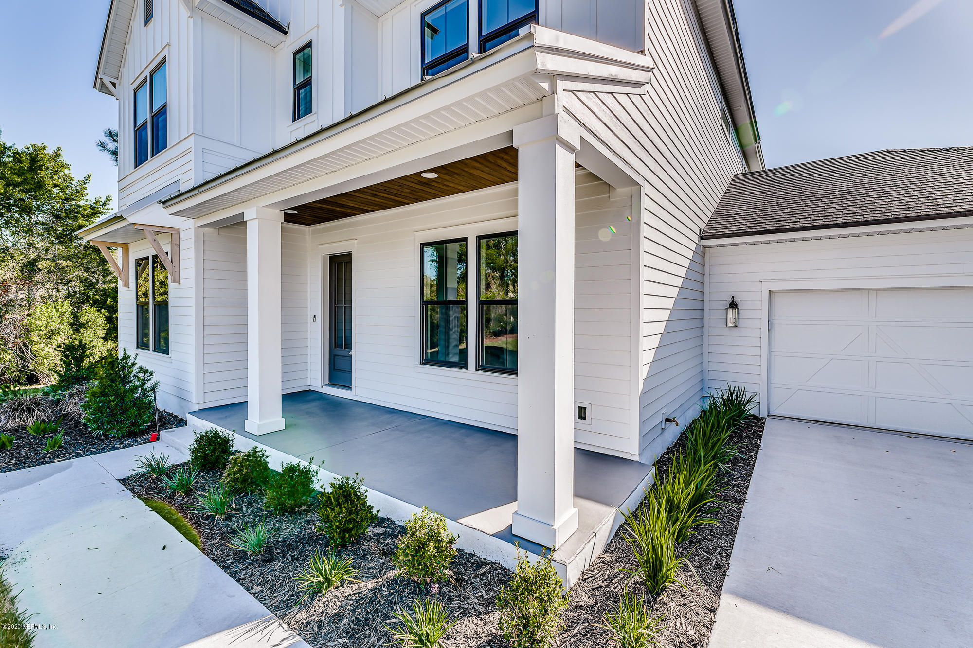 12507 Hidden Drive Jacksonville, FL 32225 - Photo 55 of 66 front view of a house with potted plants