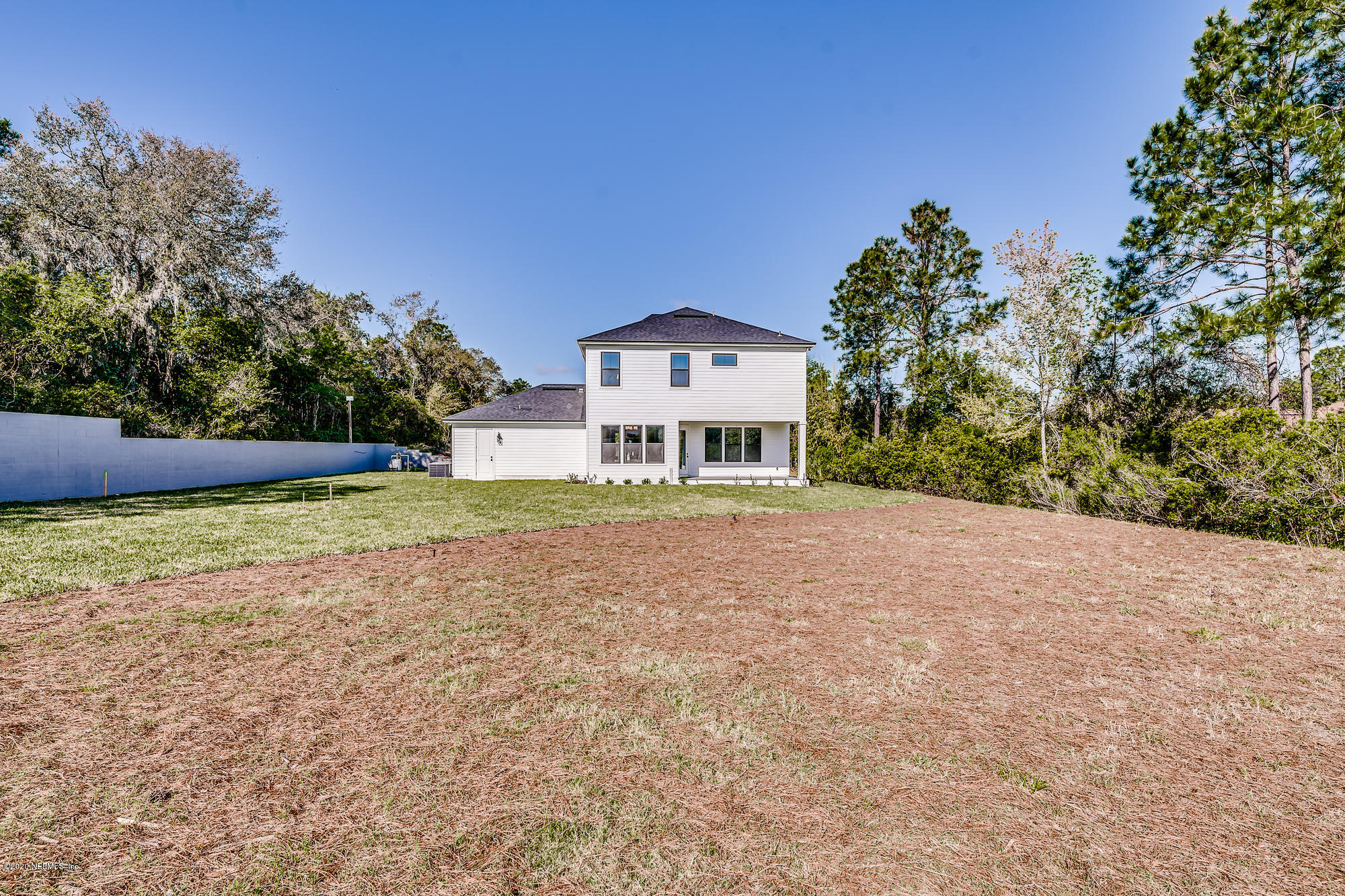 12507 Hidden Drive Jacksonville, FL 32225 - Photo 59 of 66 a front view of a house with a yard and garage