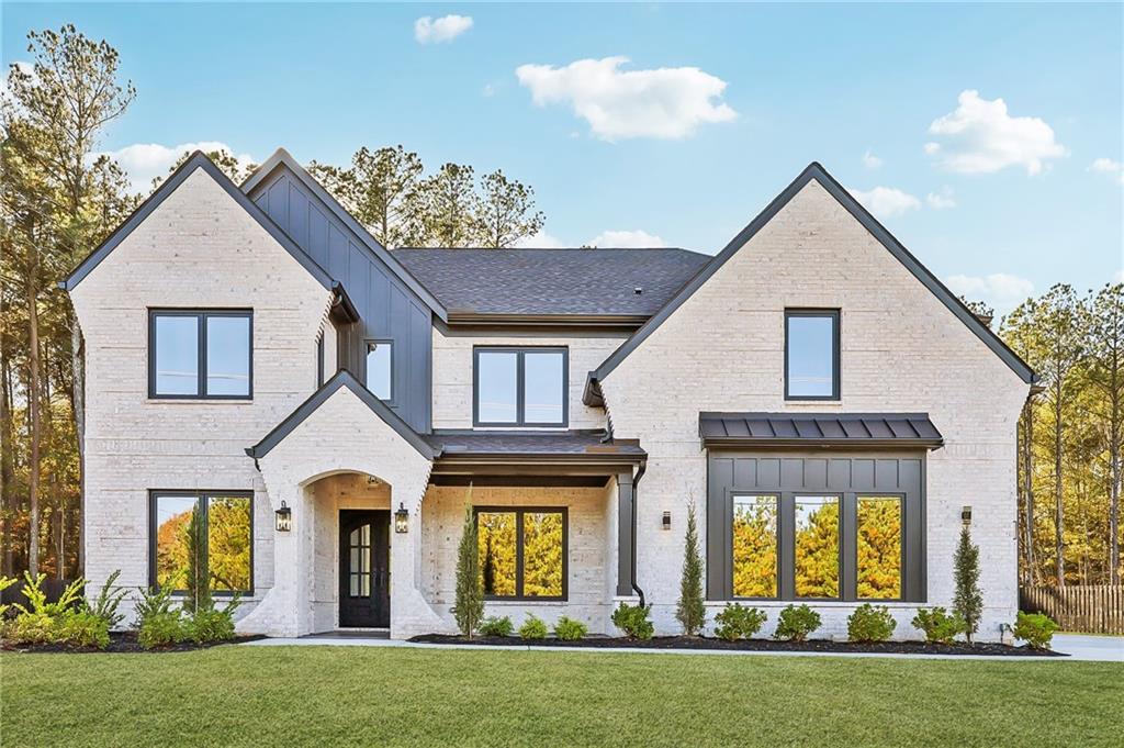 3209 Bold Springs Road Dacula, GA 30019 - Photo 1 of 62 a front view of a house with a yard