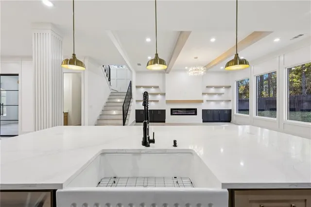 an empty room with windows and entrance