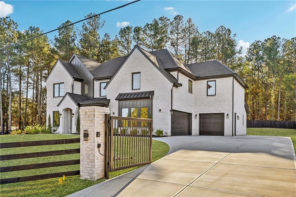 3209 Bold Springs Road Dacula, GA 30019 - Photo 2 of 62 a front view of a house with a porch