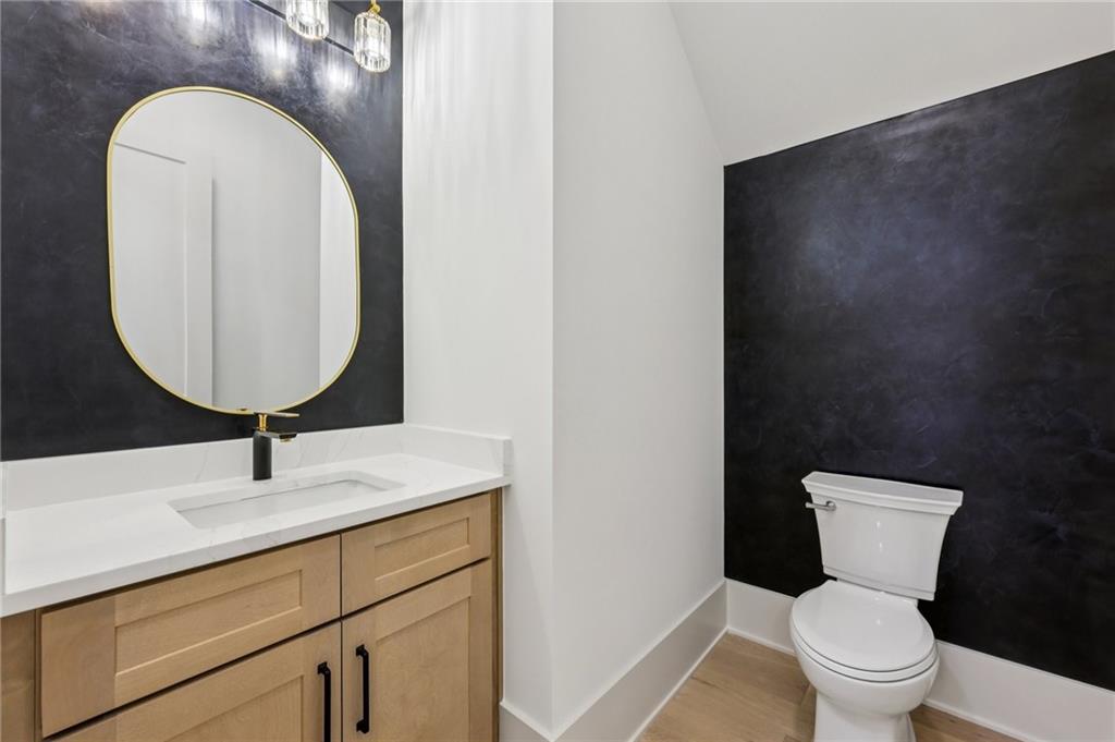 3209 Bold Springs Road Dacula, GA 30019 - Photo 23 of 62 a bathroom with a toilet sink and mirror