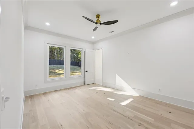 a view of livingroom with hardwood floor and windows