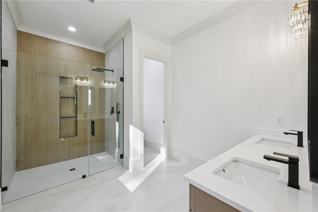 3209 Bold Springs Road Dacula, GA 30019 - Photo 29 of 62 a bathroom with a tub sink and a shower
