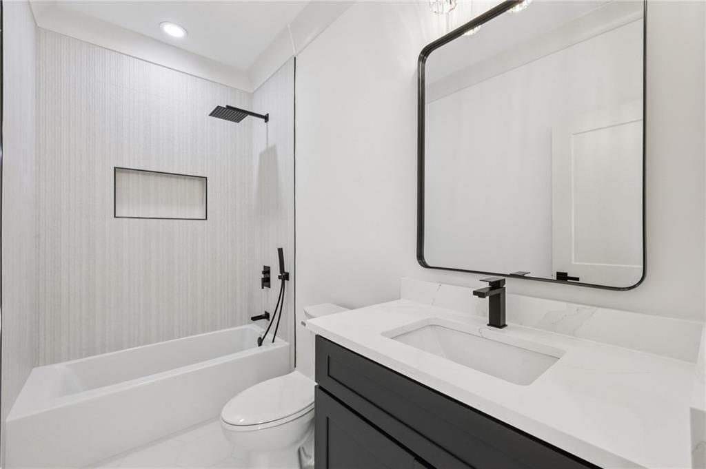3209 Bold Springs Road Dacula, GA 30019 - Photo 44 of 62 a bathroom with a sink a toilet and a mirror