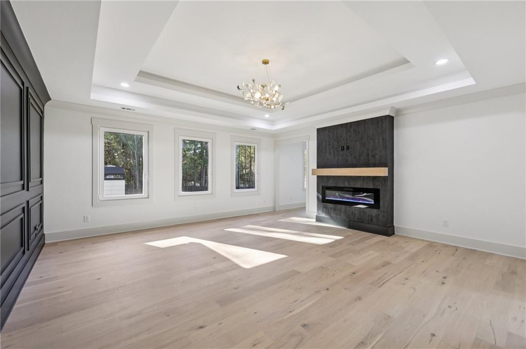 3209 Bold Springs Road Dacula, GA 30019 - Photo 46 of 62 a view of an empty room with a fireplace and a window