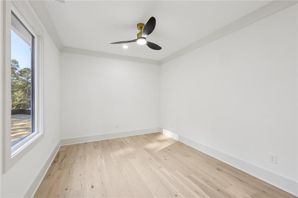 3209 Bold Springs Road Dacula, GA 30019 - Photo 50 of 62 an empty room with wooden floor and windows
