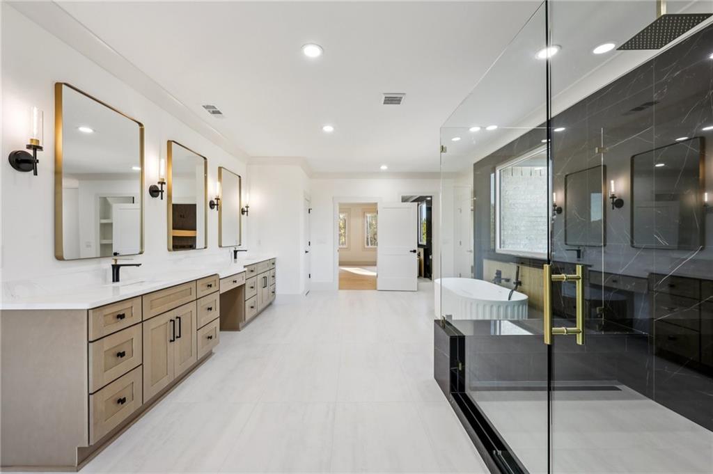 3209 Bold Springs Road Dacula, GA 30019 - Photo 54 of 62 a large bathroom with a large tub and sink