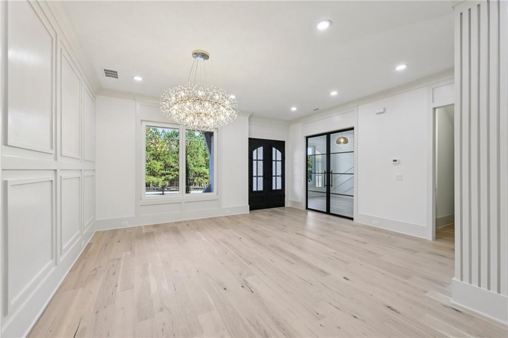 3209 Bold Springs Road Dacula, GA 30019 - Photo 6 of 62 an empty room with windows and natural light