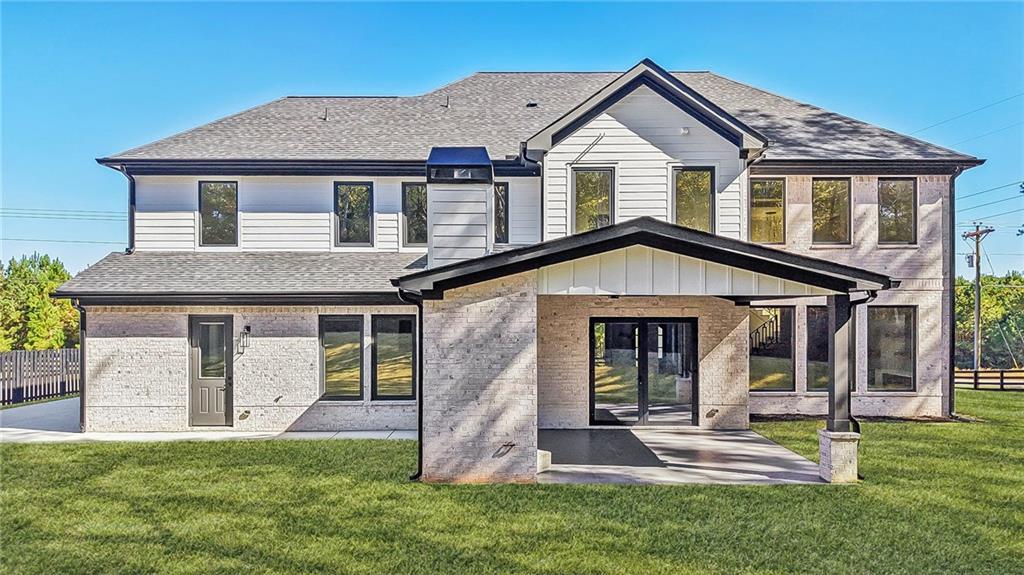 3209 Bold Springs Road Dacula, GA 30019 - Photo 61 of 62 a front view of a house with a yard