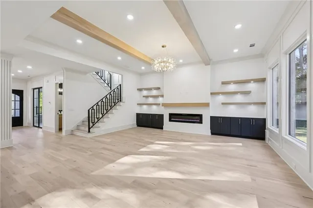 a view of kitchen with cabinets and flat screen tv