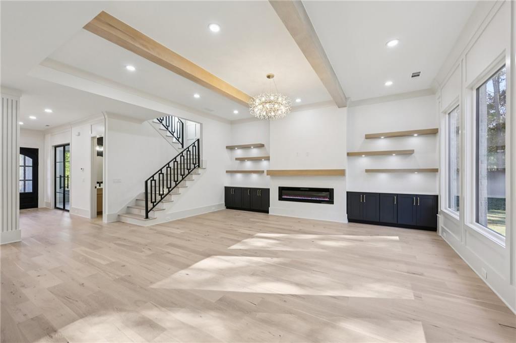 3209 Bold Springs Road Dacula, GA 30019 - Photo 9 of 62 a large white kitchen with a sink stainless steel appliances and cabinets