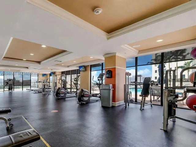 a view of a gym with lots of furniture