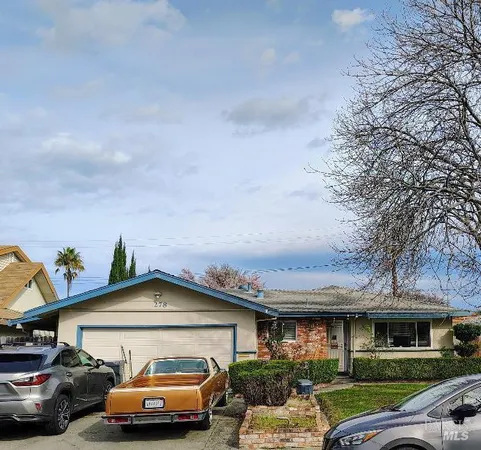 a car parked in front of a house