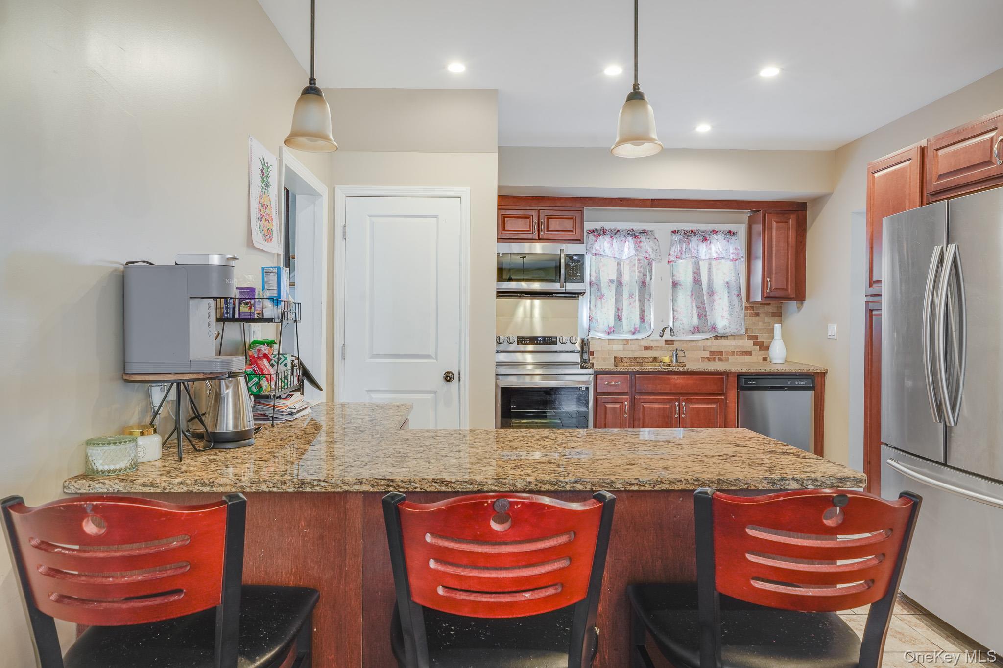 609 Washington Street Peekskill, NY 10566 - Photo 11 of 37 Eat in kitchen with stainless steel appliances.