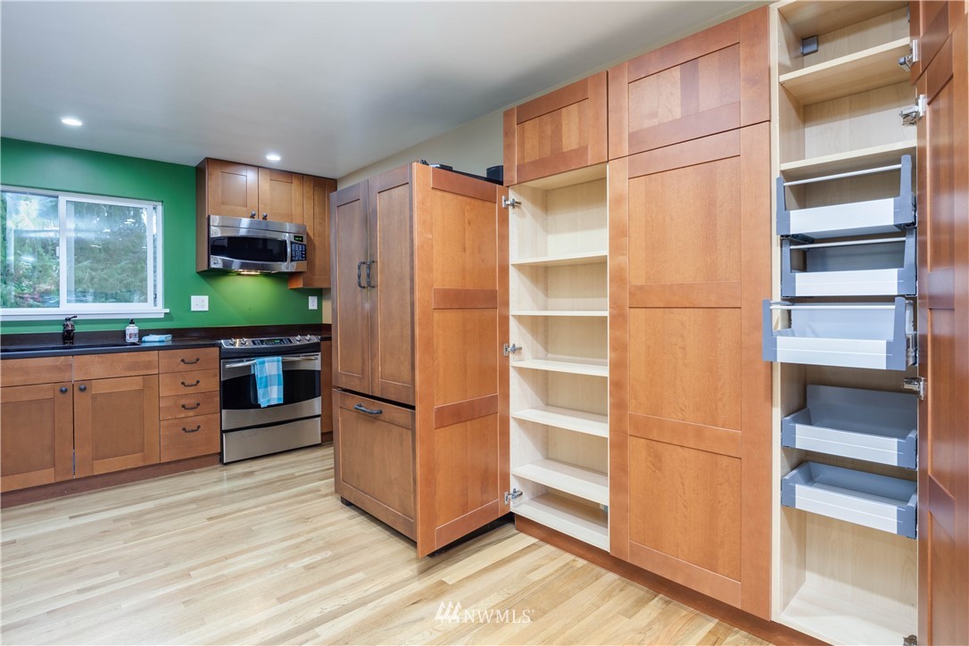 22415 73rd Place West Edmonds, WA 98026 - Photo 11 of 25 a kitchen with stainless steel appliances a refrigerator and a stove