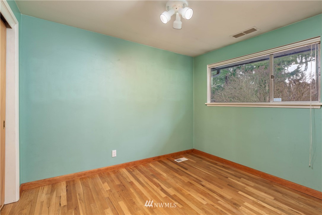 22415 73rd Place West Edmonds, WA 98026 - Photo 14 of 25 an empty room with wooden floor fan and windows