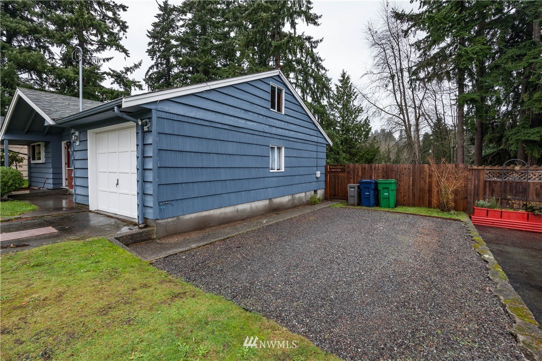 22415 73rd Place West Edmonds, WA 98026 - Photo 3 of 25 a view of backyard of house with wooden fence