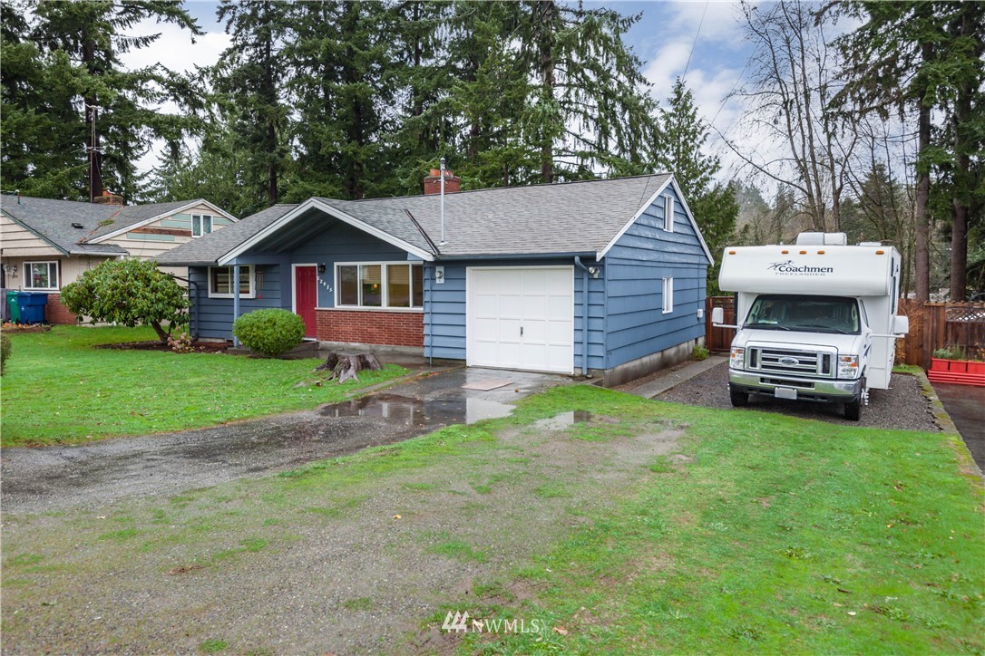 22415 73rd Place West Edmonds, WA 98026 - Photo 4 of 25 a front view of a house with garden