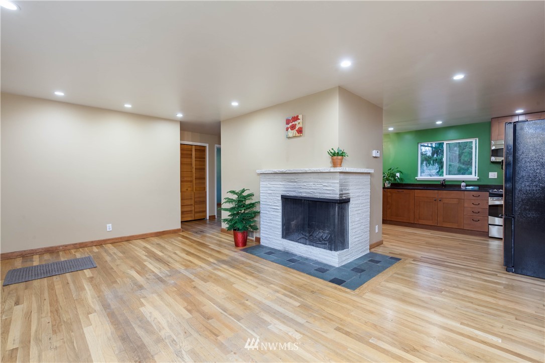 22415 73rd Place West Edmonds, WA 98026 - Photo 6 of 25 a living room with a fireplace and a fireplace