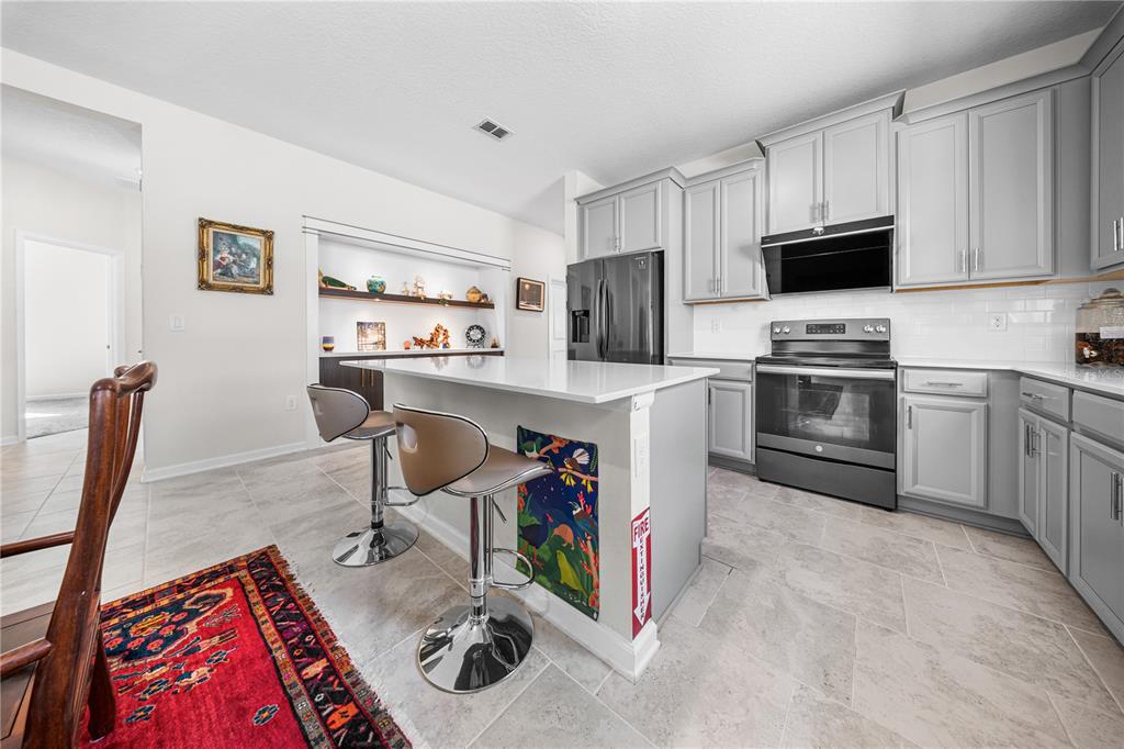 3388 Sagebrush Street Harmony, FL 34773 - Photo 13 of 56 a view of kitchen and sink
