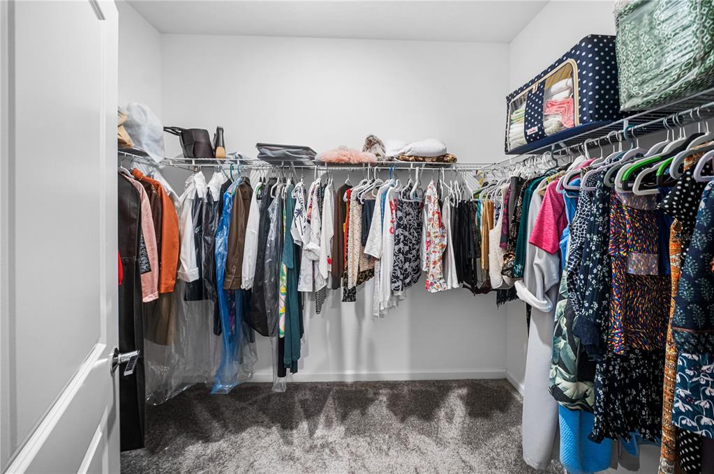 3388 Sagebrush Street Harmony, FL 34773 - Photo 31 of 56 a view of walk in closet with clothes