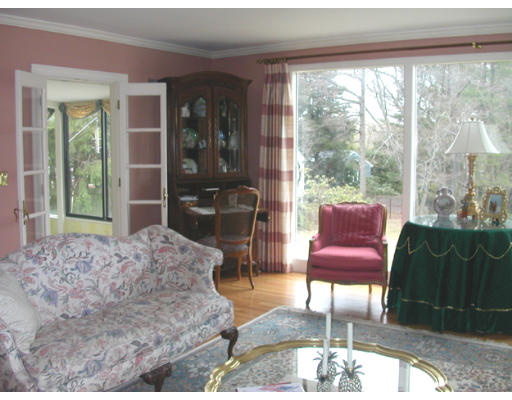 204 Chestnut Street Andover, MA 01810 - Photo 11 of 25 a living room with furniture fireplace and a floor to ceiling window