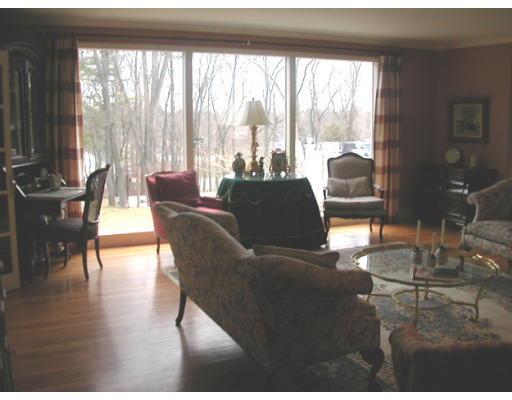 204 Chestnut Street Andover, MA 01810 - Photo 12 of 25 a dining room with furniture and wooden floor