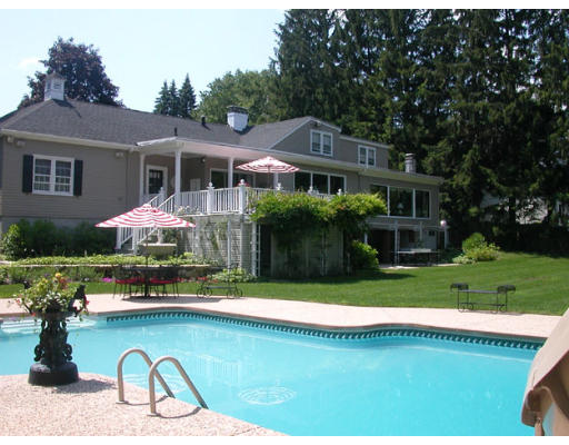 204 Chestnut Street Andover, MA 01810 - Photo 17 of 25 a front view of house with yard and outdoor seating