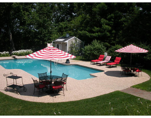 204 Chestnut Street Andover, MA 01810 - Photo 24 of 25 a view of a table and chairs under an umbrella in backyard