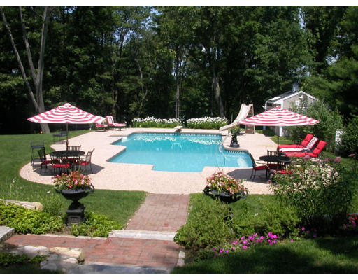 204 Chestnut Street Andover, MA 01810 - Photo 6 of 25 a view of a patio with furniture and a fire pit