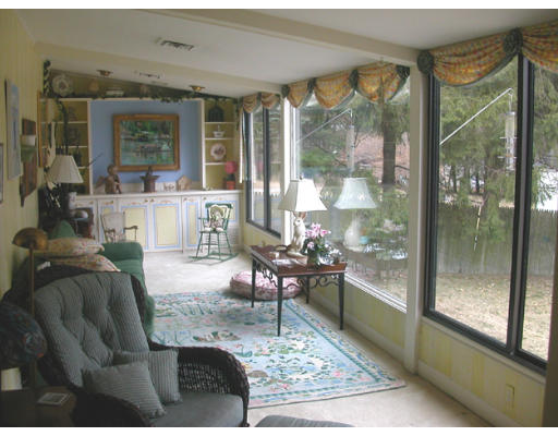 204 Chestnut Street Andover, MA 01810 - Photo 7 of 25 a living room with furniture large windows and wooden floor